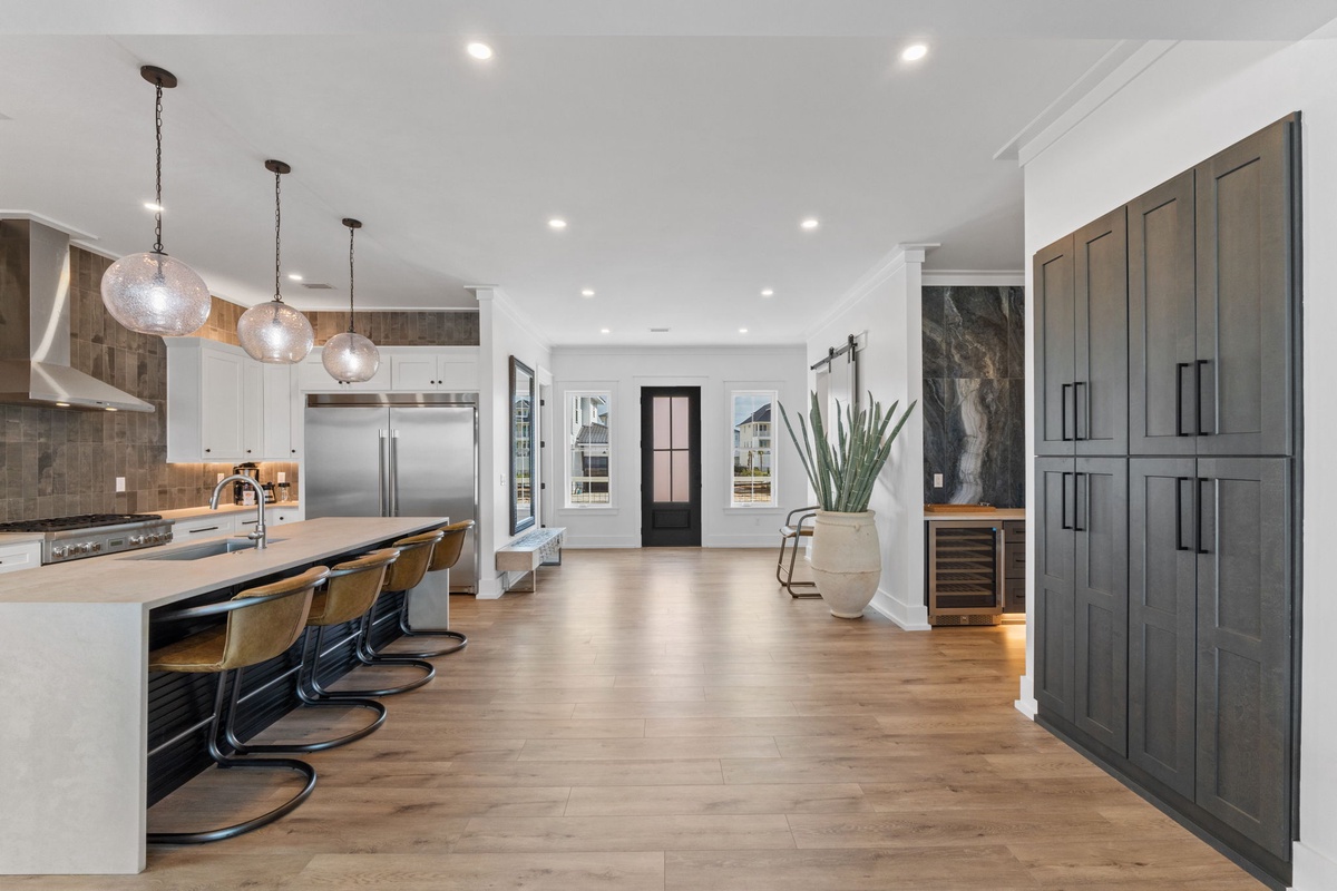 Your spacious kitchen features a stunning island with seating, premium appliances, and elegant pendant lighting for memorable meal prep.