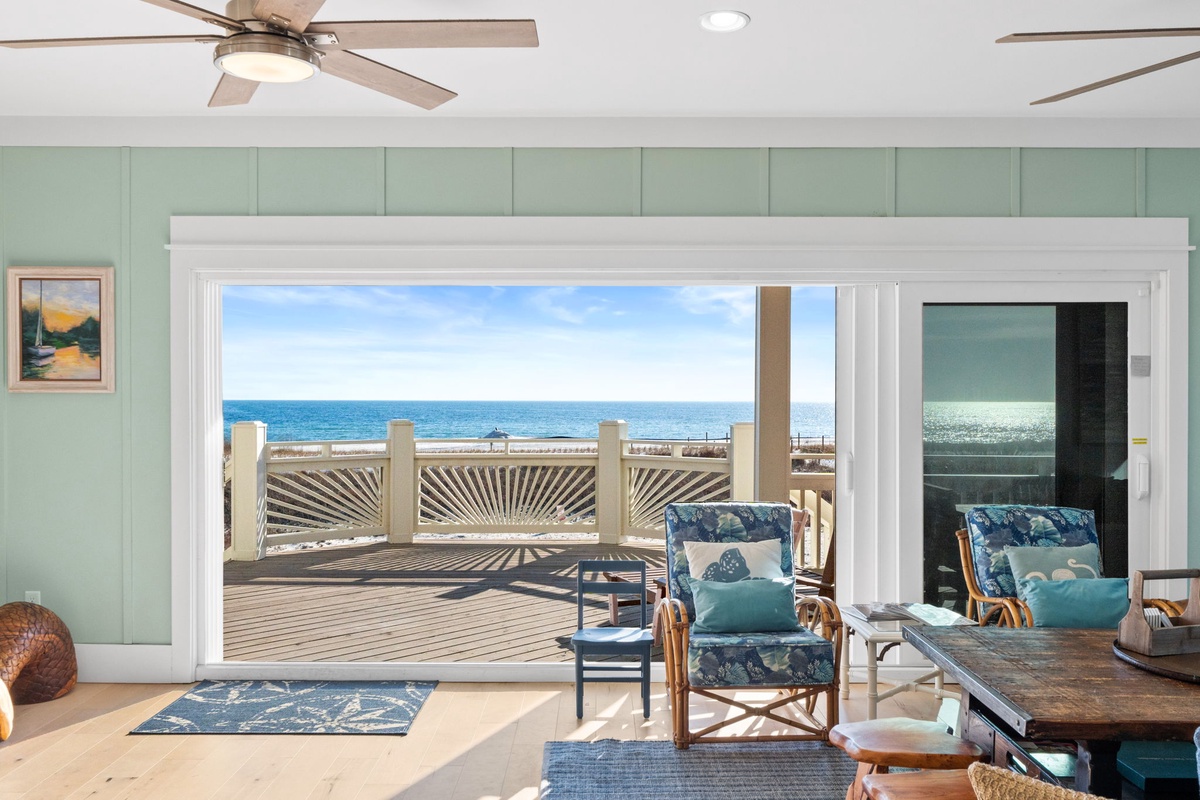 Step into your coastal sanctuary where ocean breezes flow through open doors to your private deck overlooking endless sea views.