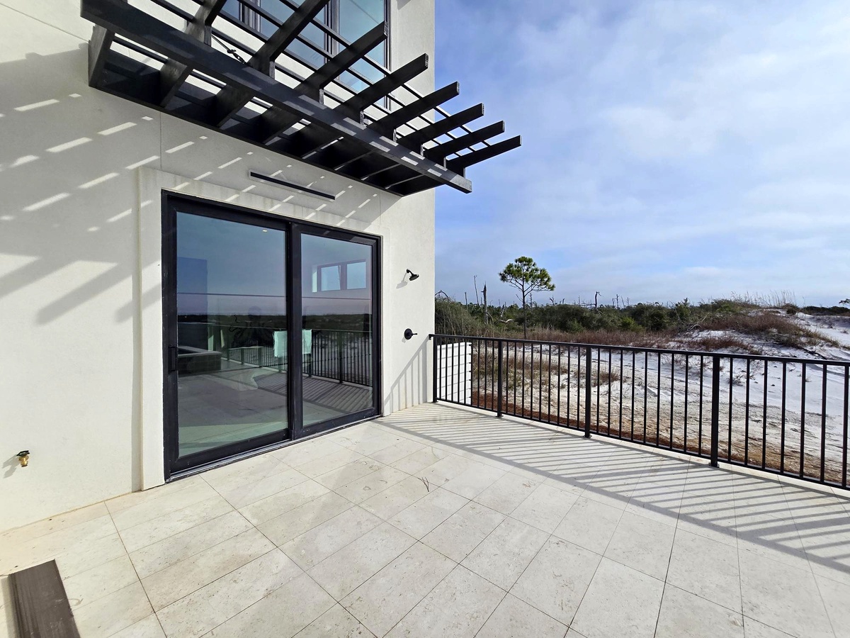 Modern property terrace offering scenic coastal views and natural landscape surroundings with contemporary architectural design.