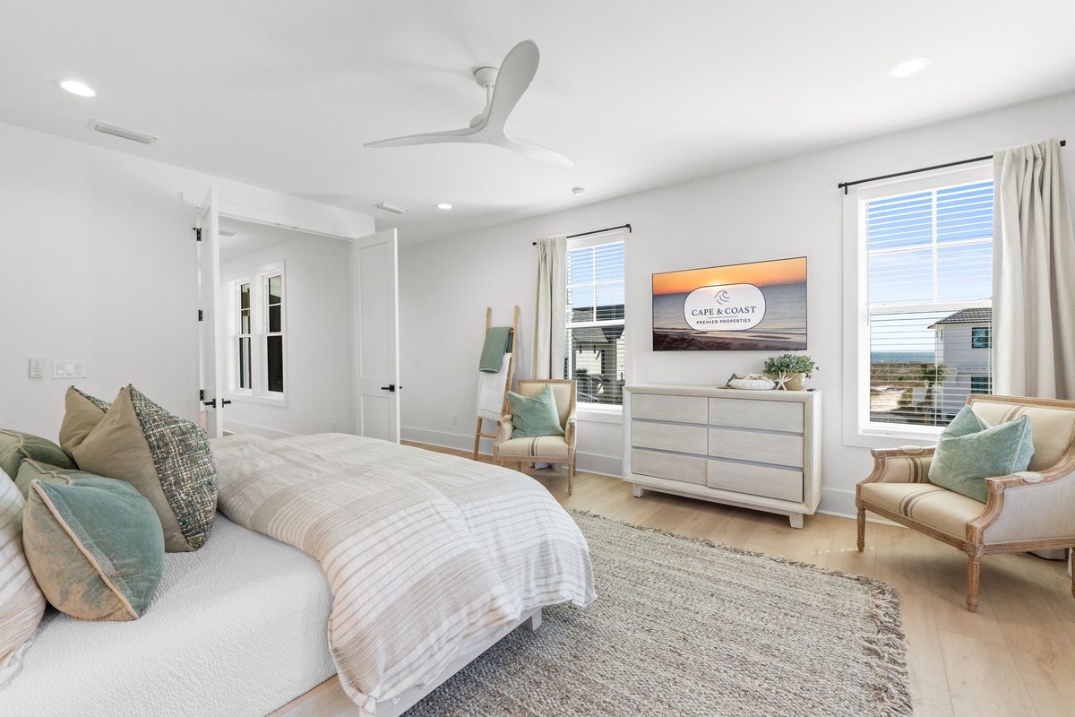 Drift off in this serene bedroom where coastal colors and plush bedding create your perfect retreat.