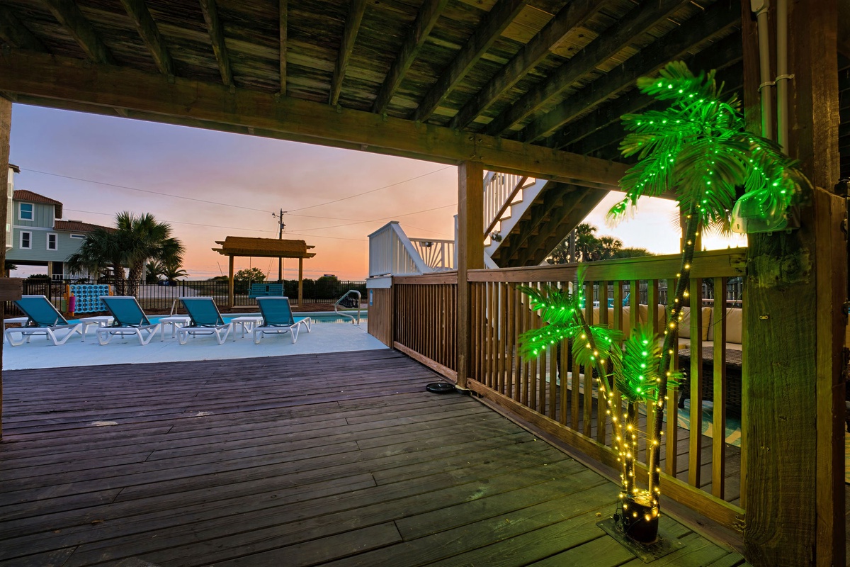 Step onto your private deck where tropical lights create magical evenings. Lounge by the pool as sunset paints the sky in stunning colors.