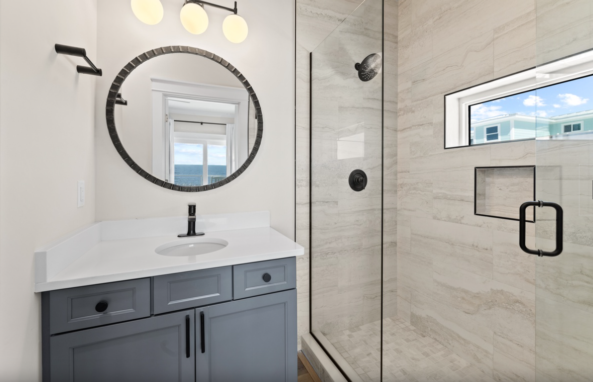 Unwind in your elegant bathroom with marble shower, ocean views, and luxurious finishes perfect for relaxing mornings.