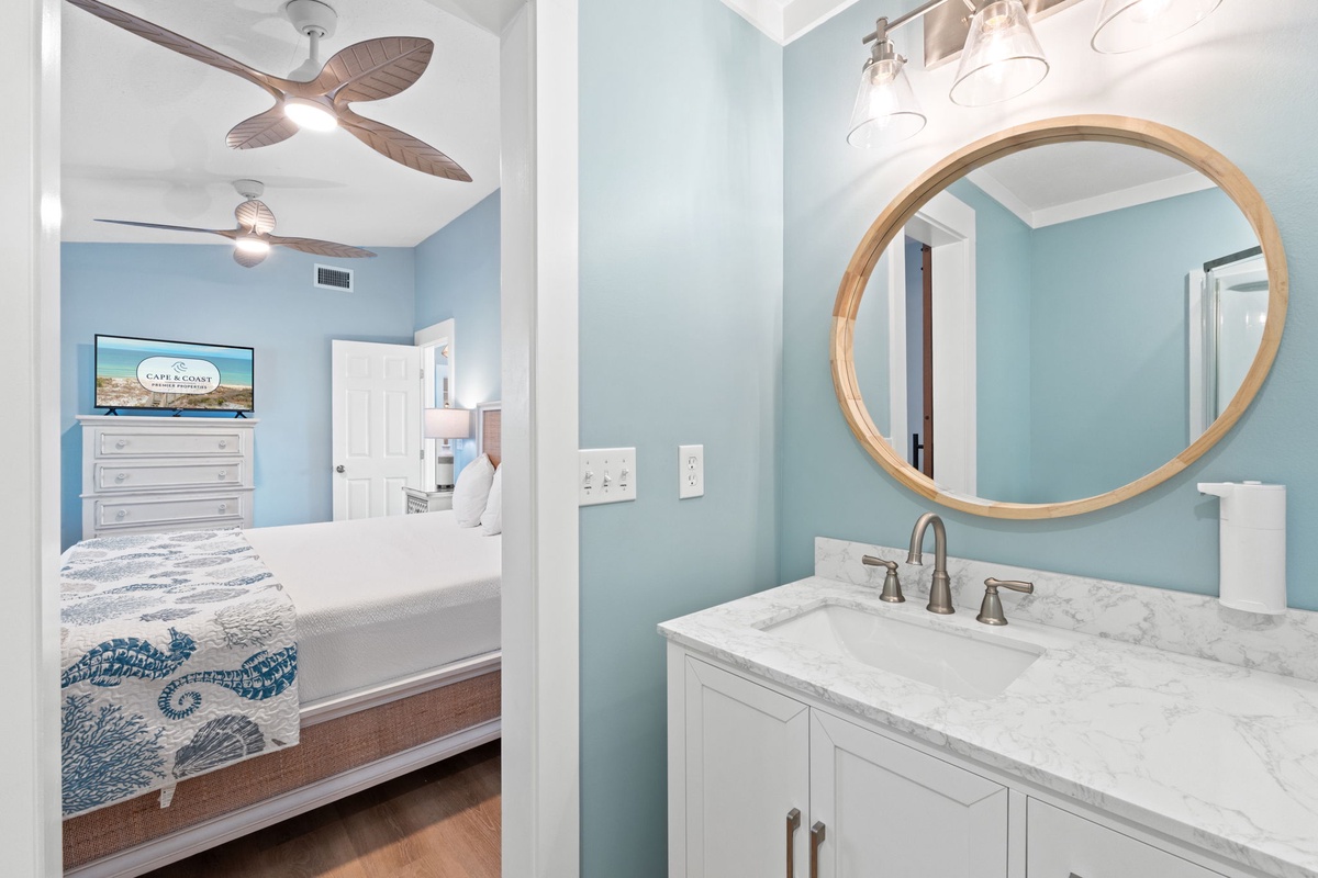 A bright vanity area connects seamlessly to the primary bedroom for added convenience.