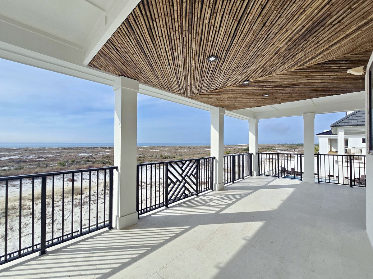 Relax on your private terrace with stunning natural landscape views, shaded by beautiful bamboo ceiling details.
