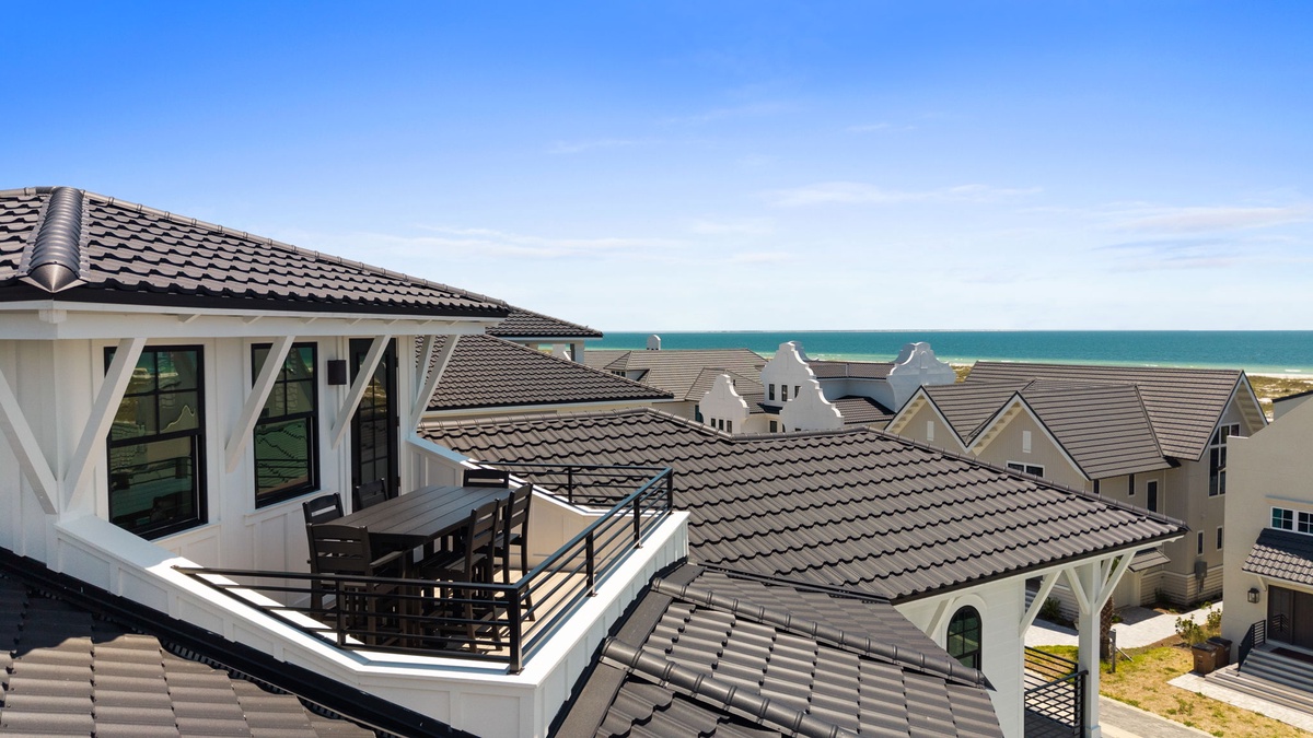 Stunning beachfront location with turquoise waters and golden sand just steps from this coastal community. A peaceful, sun-drenched setting on the waterfront.
