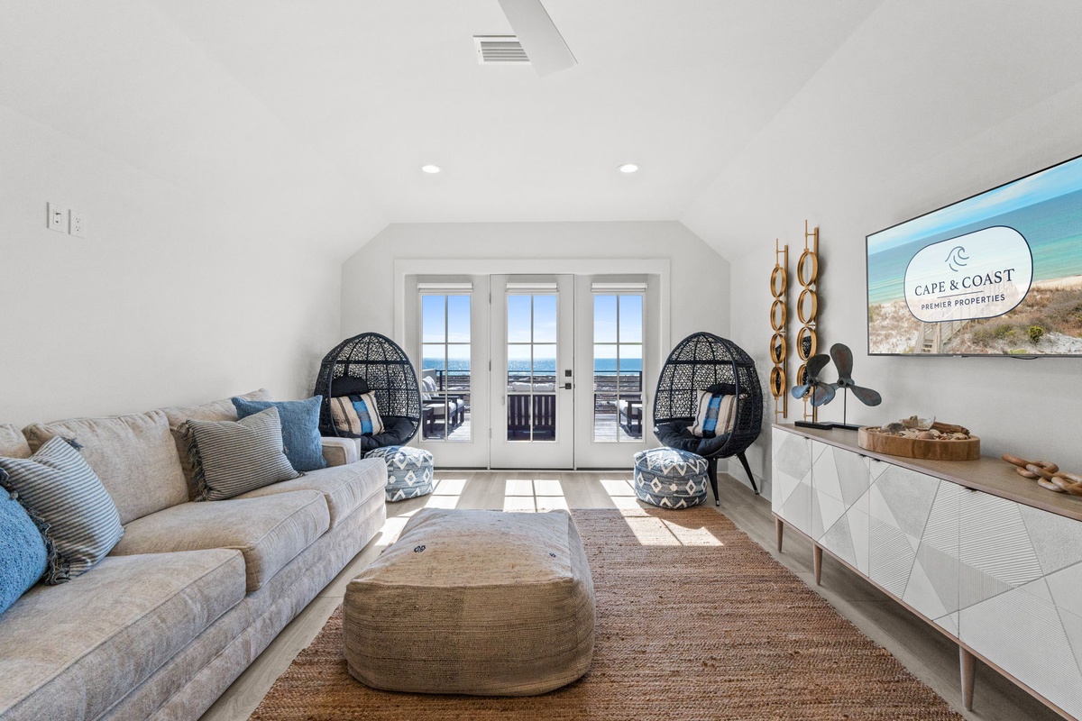 Unwind in your beautifully designed living space with ocean views through French doors leading to your private balcony.