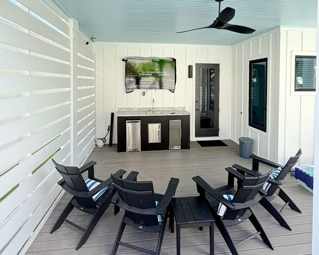 Gather under the stars on your private covered deck with a full entertainment bar, TV, and plush seating—perfect for movie nights or unwinding with drinks after a day of adventure.