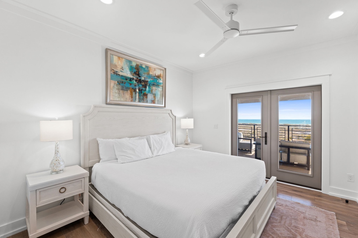 Wake up to stunning ocean views from your cozy bedroom, where crisp linens and gentle sea breezes create the perfect coastal retreat.