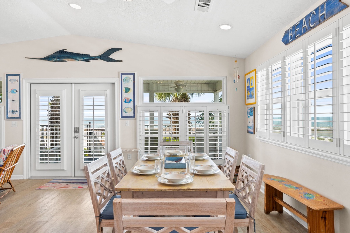 Your bright dining space features coastal décor and opens to a stunning balcony overlooking the ocean.