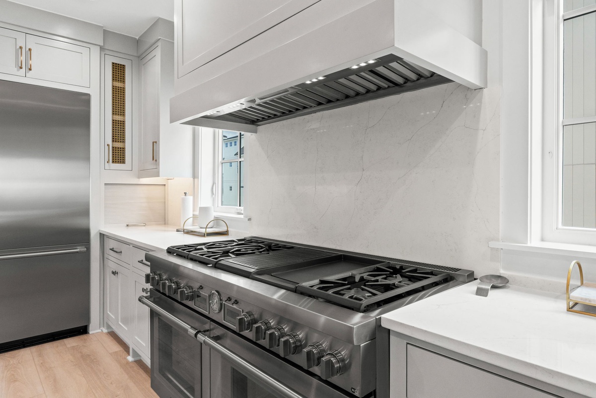 Your gourmet kitchen awaits with professional-grade appliances and elegant marble backsplash, perfect for creating memorable meals.