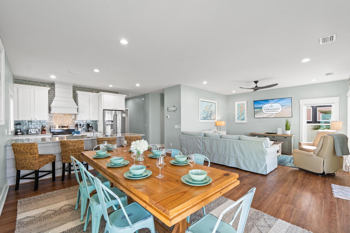 Gather your family around the spacious dining table, where coastal charm meets modern comfort. The open layout connects you to the kitchen and living spaces, making every meal feel like a celebration together.