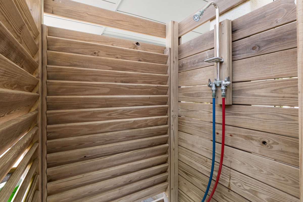 Refresh yourself in your private outdoor shower, surrounded by warm wood paneling for complete privacy.