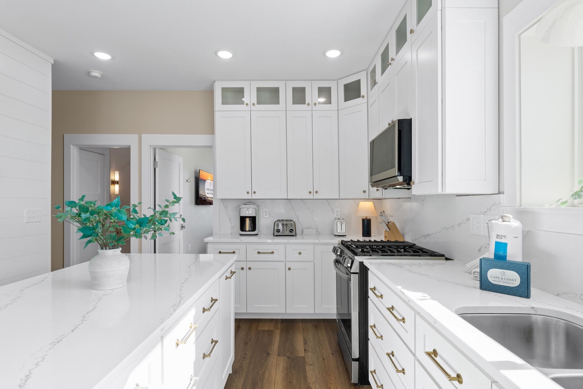 Your gourmet kitchen awaits with marble countertops, stainless appliances, and everything you need to create memorable meals together.