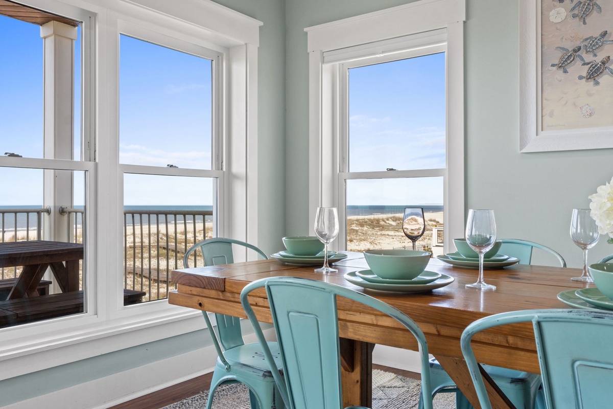 Gather around this coastal dining table where ocean breezes and beach views create the perfect backdrop for your morning coffee or evening meal by the sea.