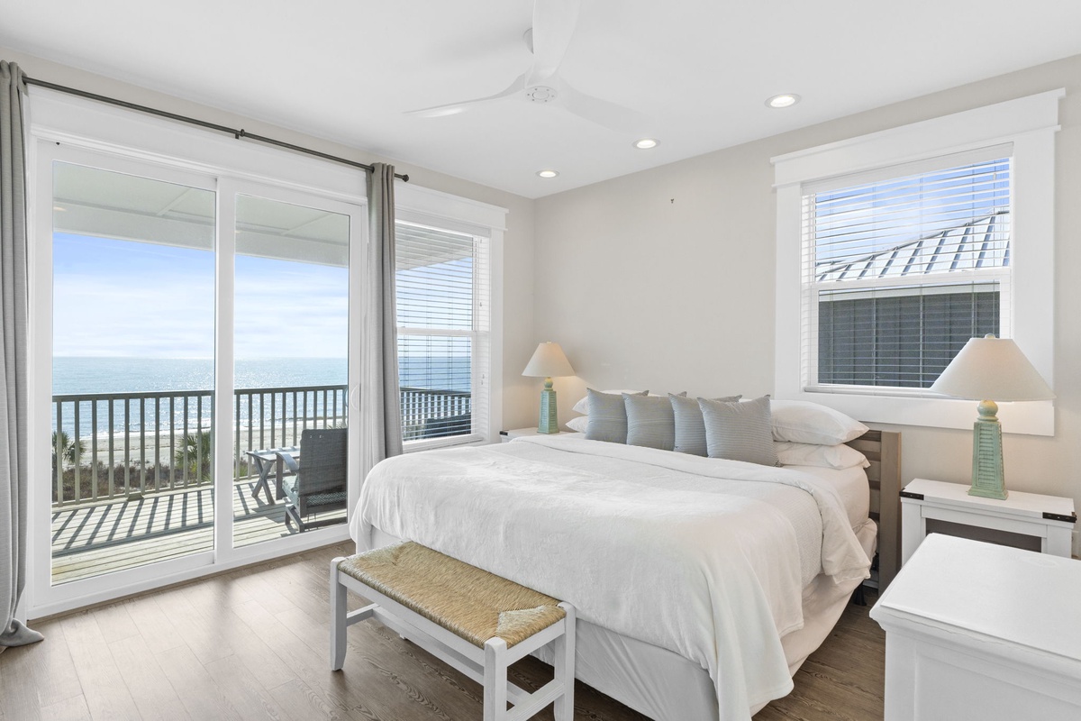 Wake up to stunning oceanfront views from your cozy bed, with sliding doors opening to your private balcony overlooking endless blue waters.
