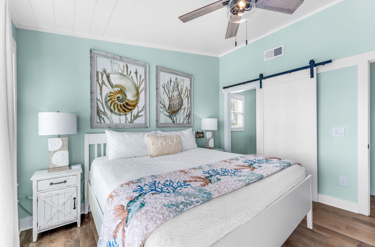 Drift off in your coastal bedroom sanctuary, where soothing sea salt walls and ocean-inspired art create perfect tranquility for restful nights.