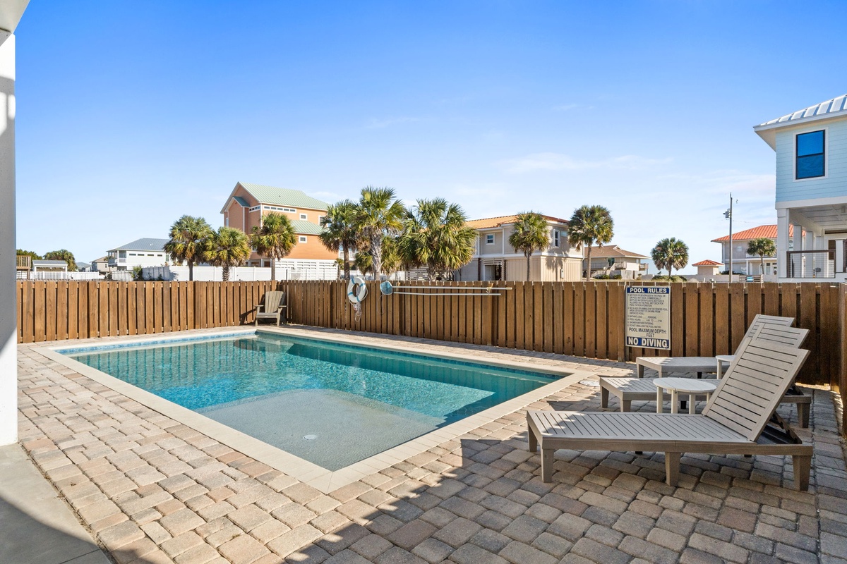 Take a refreshing dip in your private pool, then unwind on comfortable loungers surrounded by tropical palms and coastal charm.