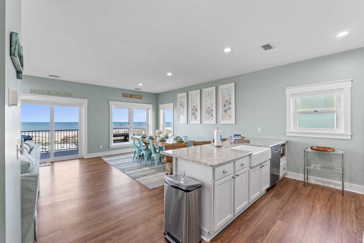Wake up to ocean breezes in this light-filled space. Coastal hues set a soothing tone while you enjoy ocean views from every angle. The open kitchen invites easy meal prep steps from the dining area.