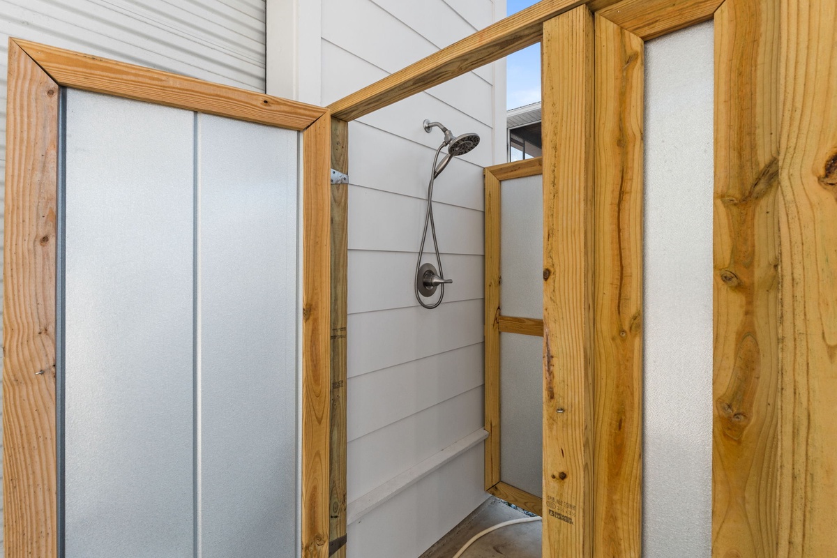 Step into your rustic-chic shower with warm wood accents and modern fixtures for a refreshing mountain retreat experience.