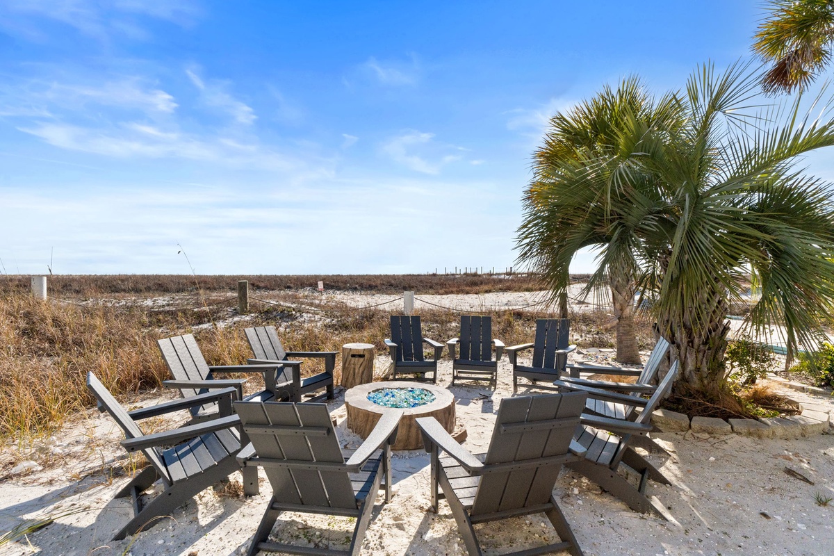 Gather around your private fire pit with Adirondack chairs, swaying palms overhead, and endless beach views stretching beyond.