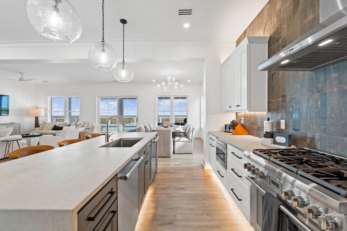 Your gourmet kitchen features stunning lake views, premium appliances, and elegant pendant lighting for memorable cooking experiences.
