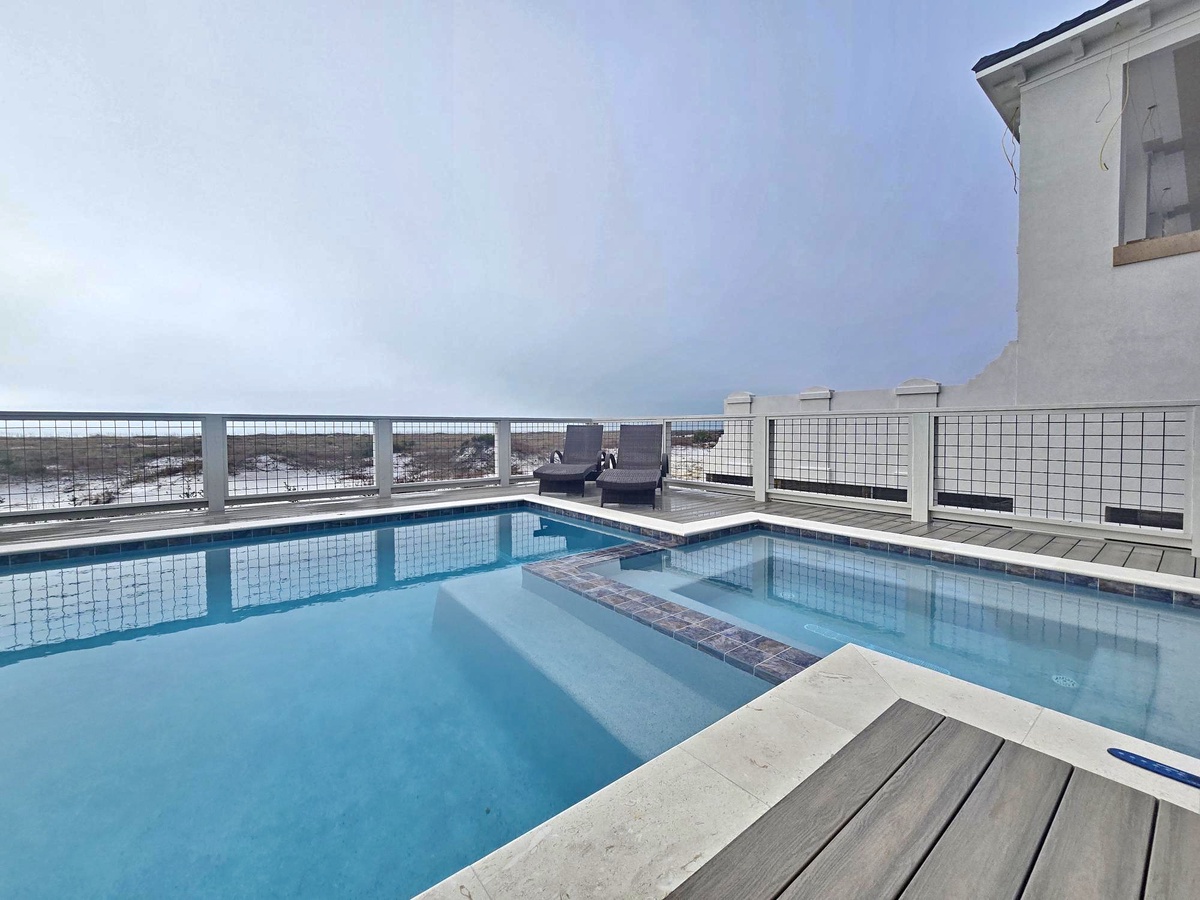 Take a refreshing dip in your private pool while gazing over breathtaking ocean views from this stunning rooftop deck.