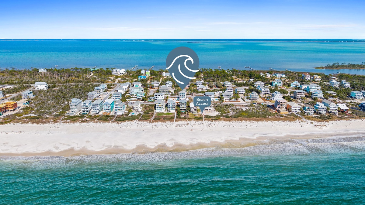Stunning beachfront community with pristine white sand beaches and crystal-clear turquoise waters stretching to the horizon.