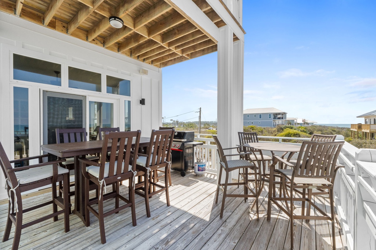 Your spacious covered deck offers perfect outdoor dining with two seating areas and a BBQ for memorable family meals.