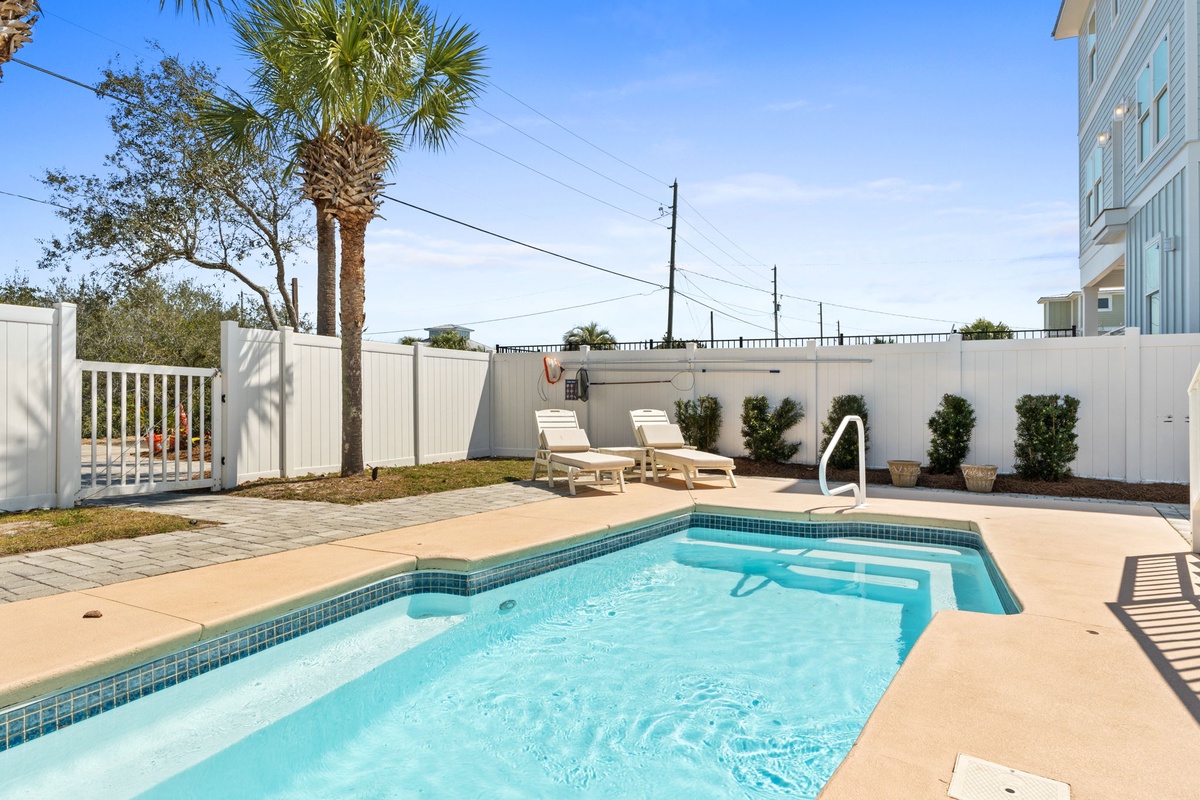 Dive into your private oasis with this sparkling pool, perfect for cooling off under the Florida sun.