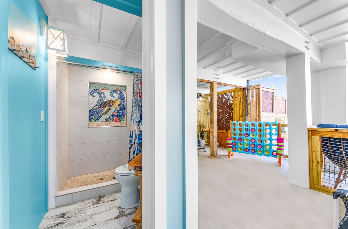 You'll love this playful space where coastal charm meets family fun—featuring colorful games and whimsical dolphin art for memorable moments together.