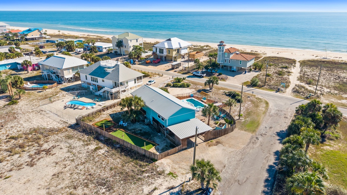 An aerial view highlights the home’s proximity to the beach and its inviting coastal setting along the Forgotten Coast.
