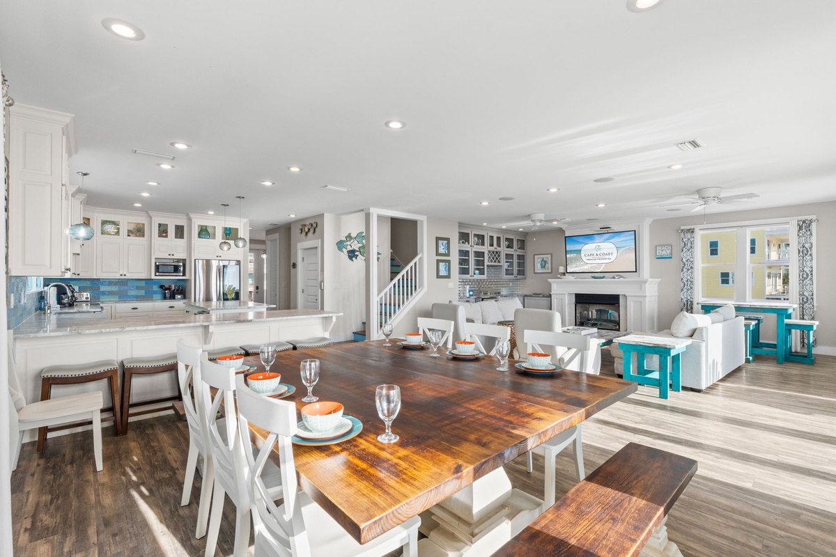 Gather around your stunning dining table while the chef prepares meals in your gourmet kitchen, creating perfect moments together.