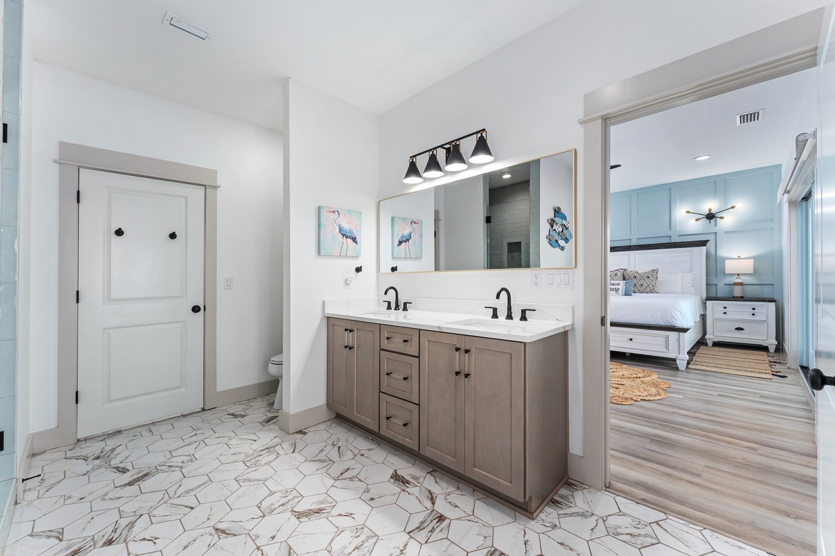 Your stylish ensuite bathroom features dual vanities and connects seamlessly to your peaceful bedroom retreat.