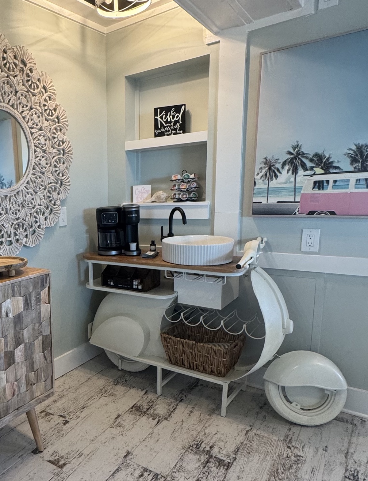 Start your mornings right with this charming coffee station featuring modern conveniences in a whimsically designed space that brightens every day.