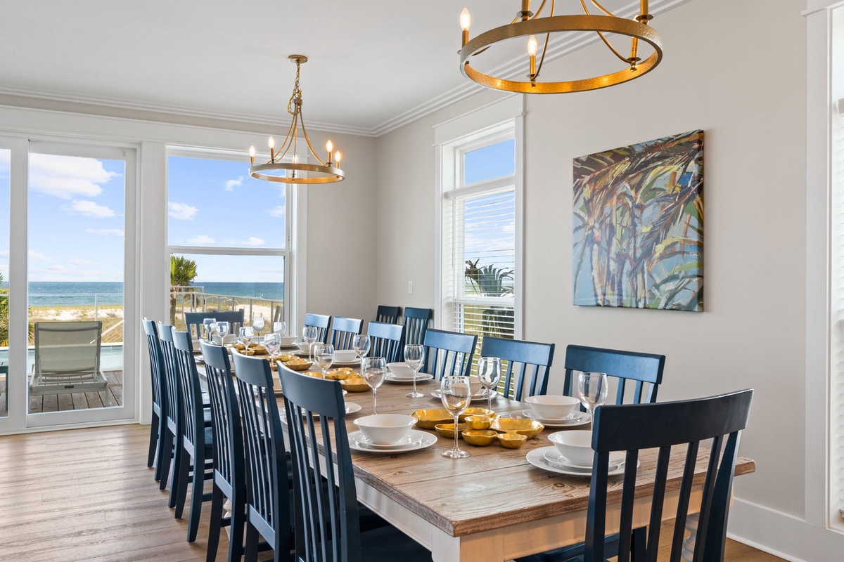 Gather around the spacious dining table with your family and friends, where every meal comes with a stunning ocean backdrop through floor-to-ceiling windows.
