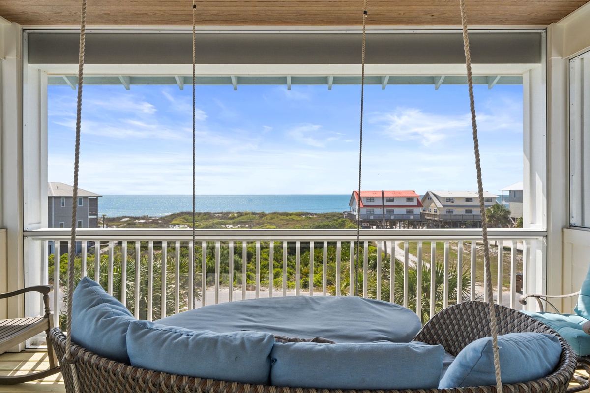 Drift off in your private hanging bed while ocean breezes flow through your screened balcony, sea views stretching endlessly ahead.