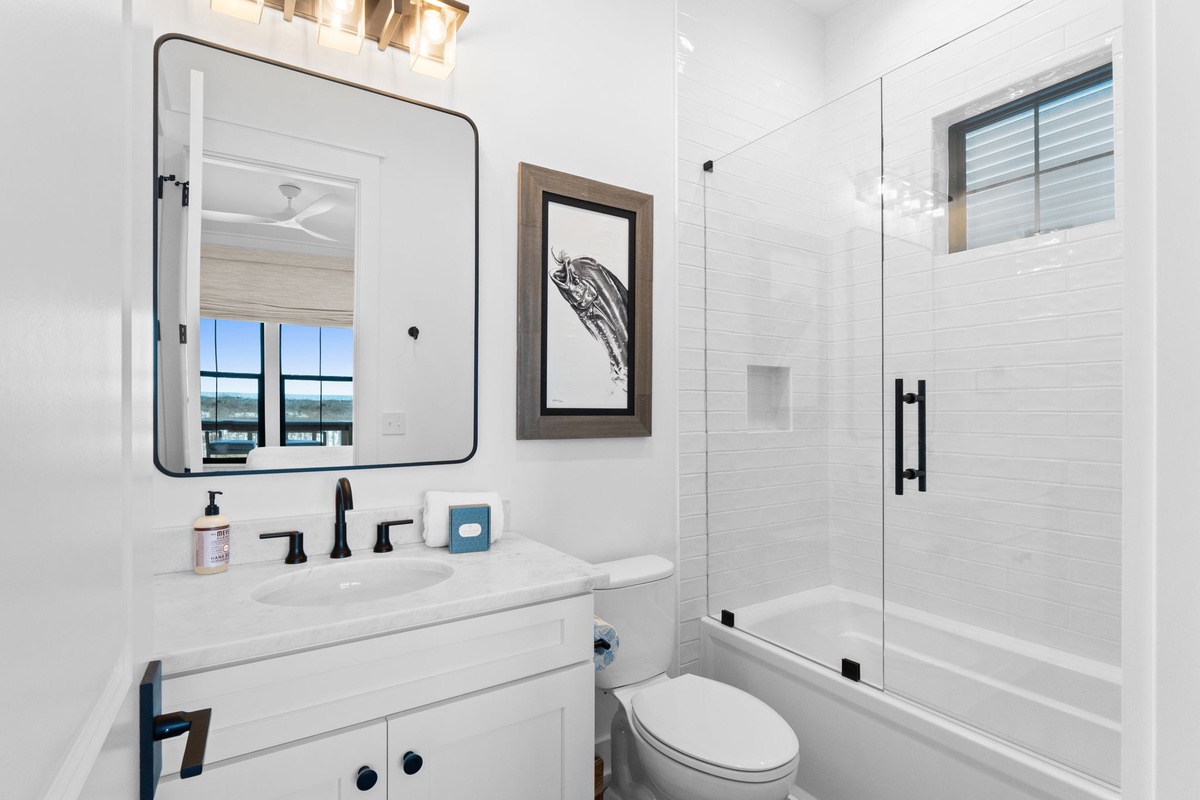 Refresh in your pristine bathroom with sleek marble counters, rainfall shower, and soaking tub—complete luxury after your busy day.