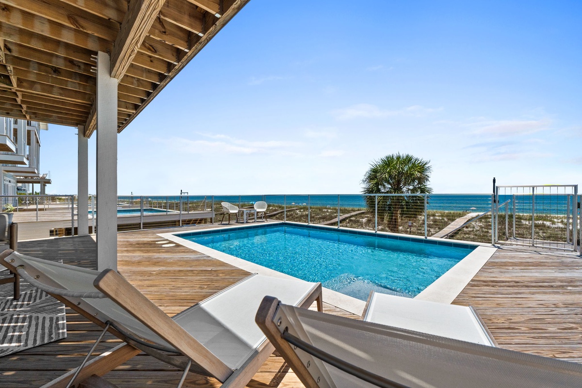 Stunning private pool deck with direct beach access and sweeping ocean views—your coastal oasis for sunlit days and tranquil evenings.