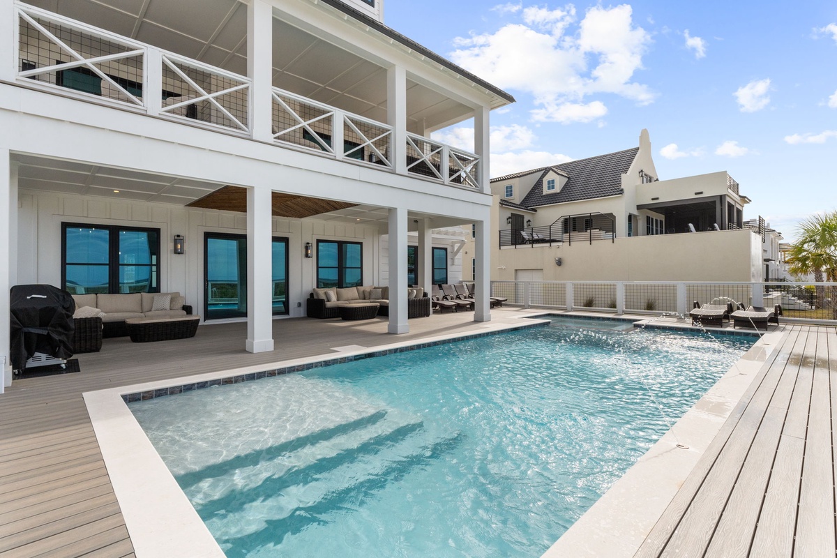 Modern beachfront home with private pool and expansive deck for ultimate coastal relaxation.
