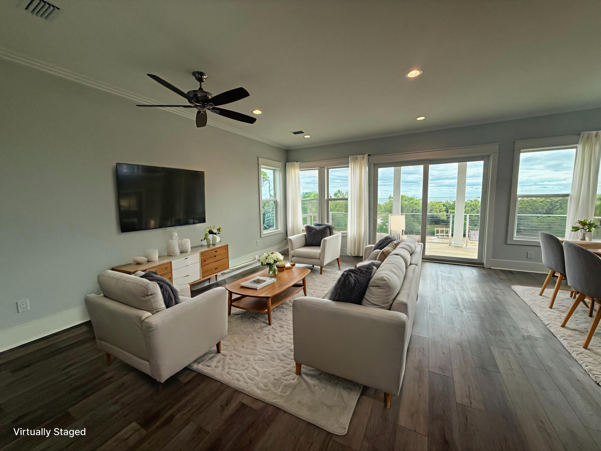 Relax in your bright, modern living space with panoramic windows showcasing stunning views and comfortable seating for unwinding after your adventures.