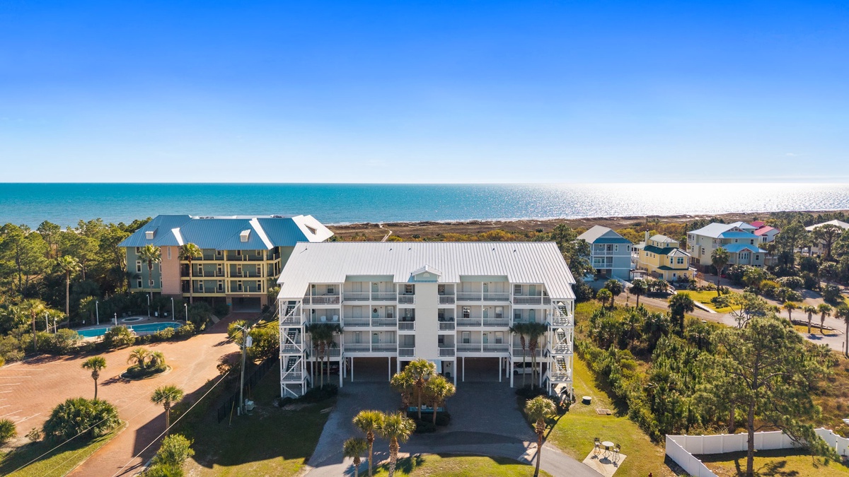 Beachfront vacation rental property featuring multiple buildings with stunning ocean access and coastal community setting.