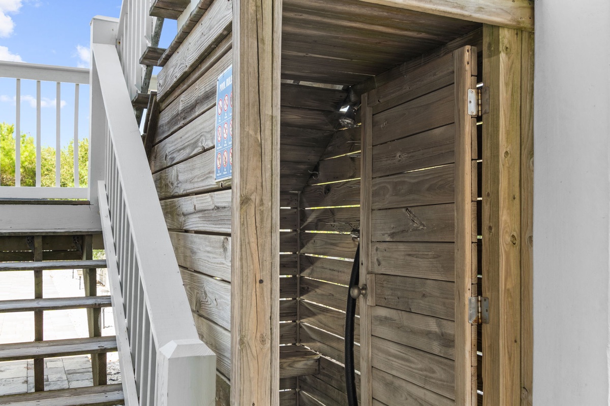 Step into your private outdoor sauna, where warm wood and slatted lighting create a tranquil retreat. Just beyond, a bright deck awaits for post-sauna relaxation with nature views.