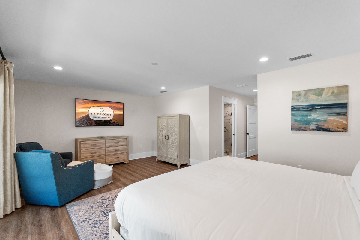 Unwind in your serene bedroom with coastal artwork, plush seating, and ample storage. Drift off surrounded by soothing beach-inspired décor.
