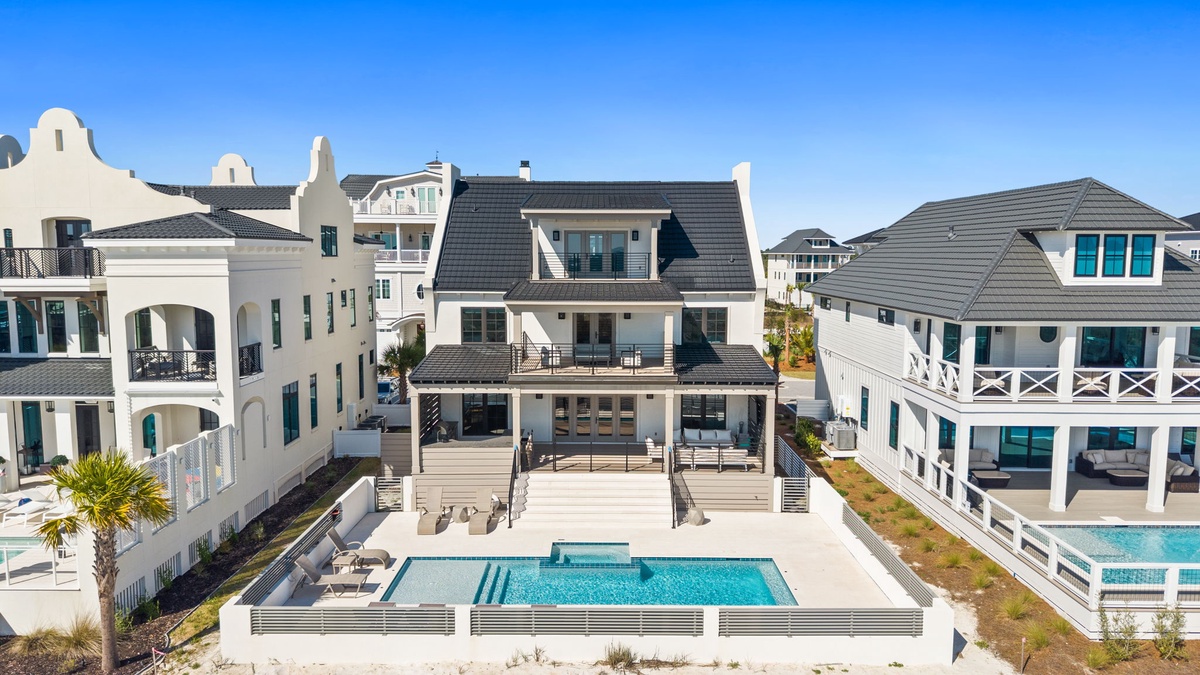 Stunning beachfront home with private pool and elegant architecture in an exclusive coastal neighborhood.