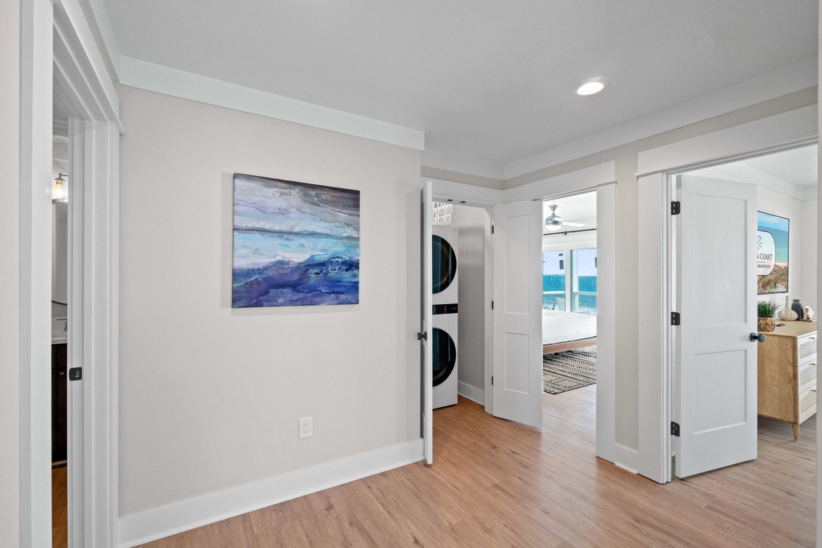 Your private laundry area keeps your vacation wardrobe fresh with convenient stacked washer and dryer tucked behind elegant doors.