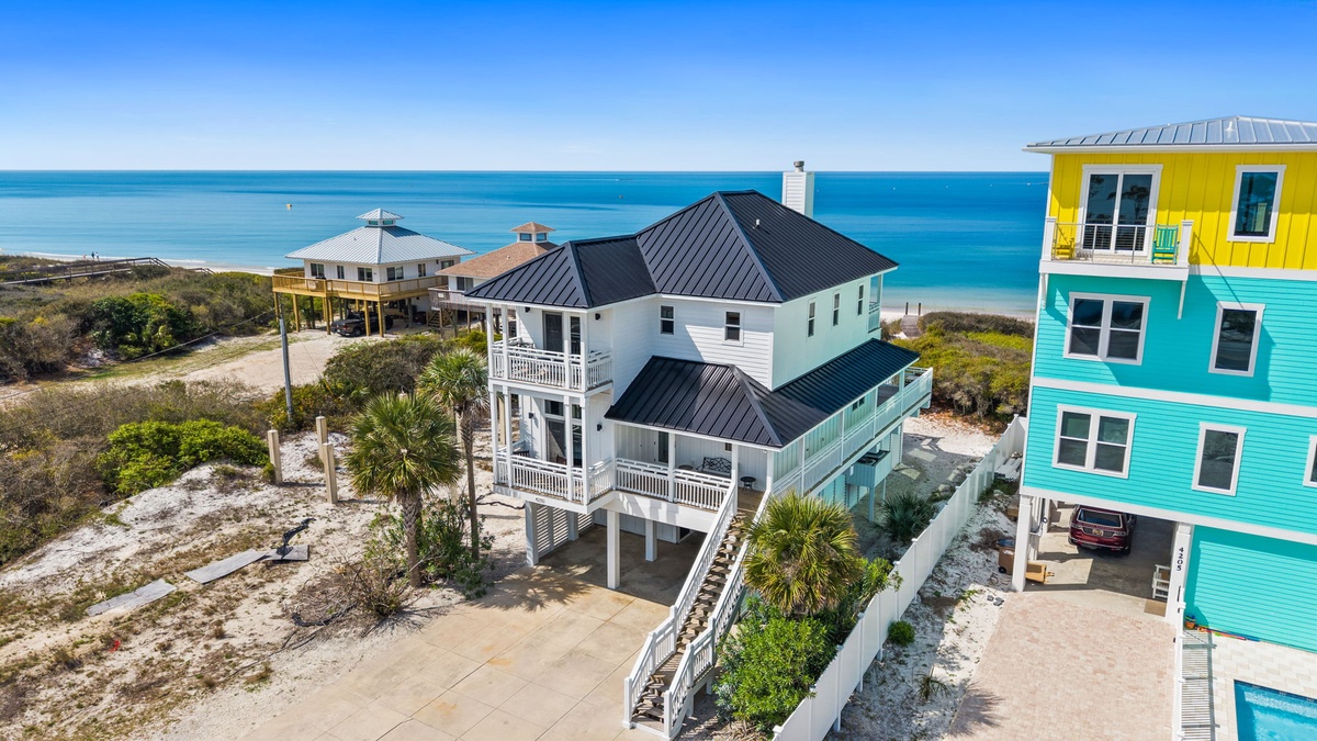 Elevated beachfront homes offering stunning ocean views and easy beach access in this pristine coastal community.
