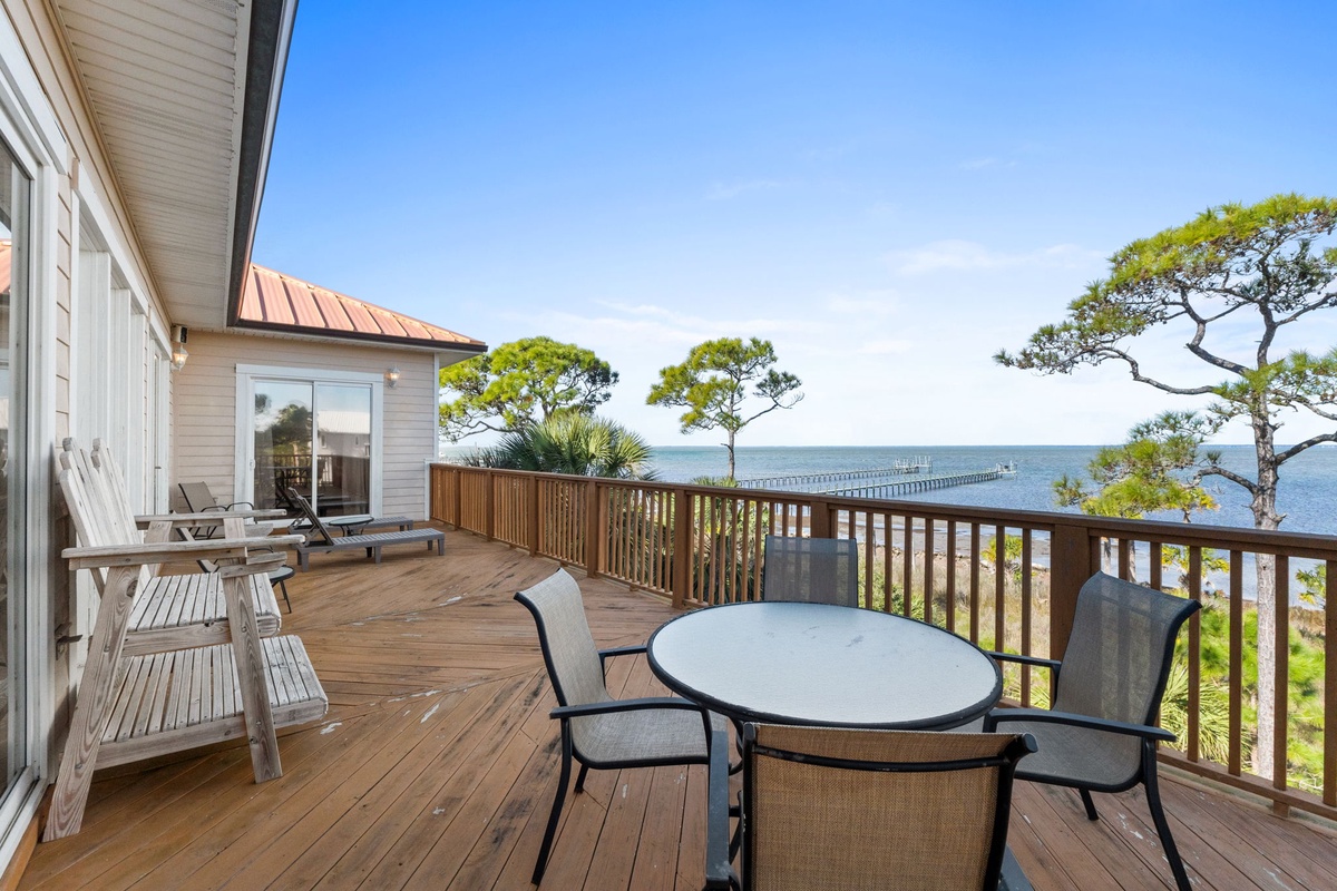 Unwind on this expansive deck with stunning water views, comfortable seating, and peaceful coastal surroundings perfect for morning coffee or sunset dinners.