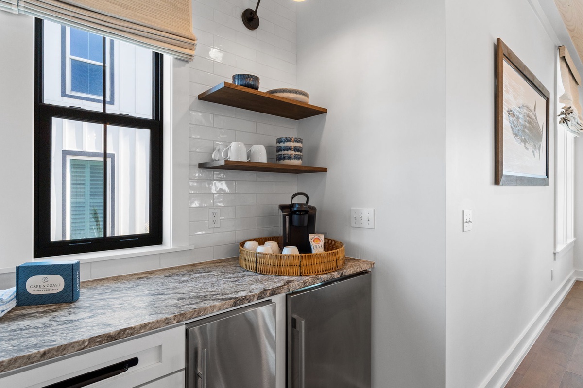 Your thoughtfully designed kitchenette features granite counters, floating shelves, and everything you need for a comfortable stay.