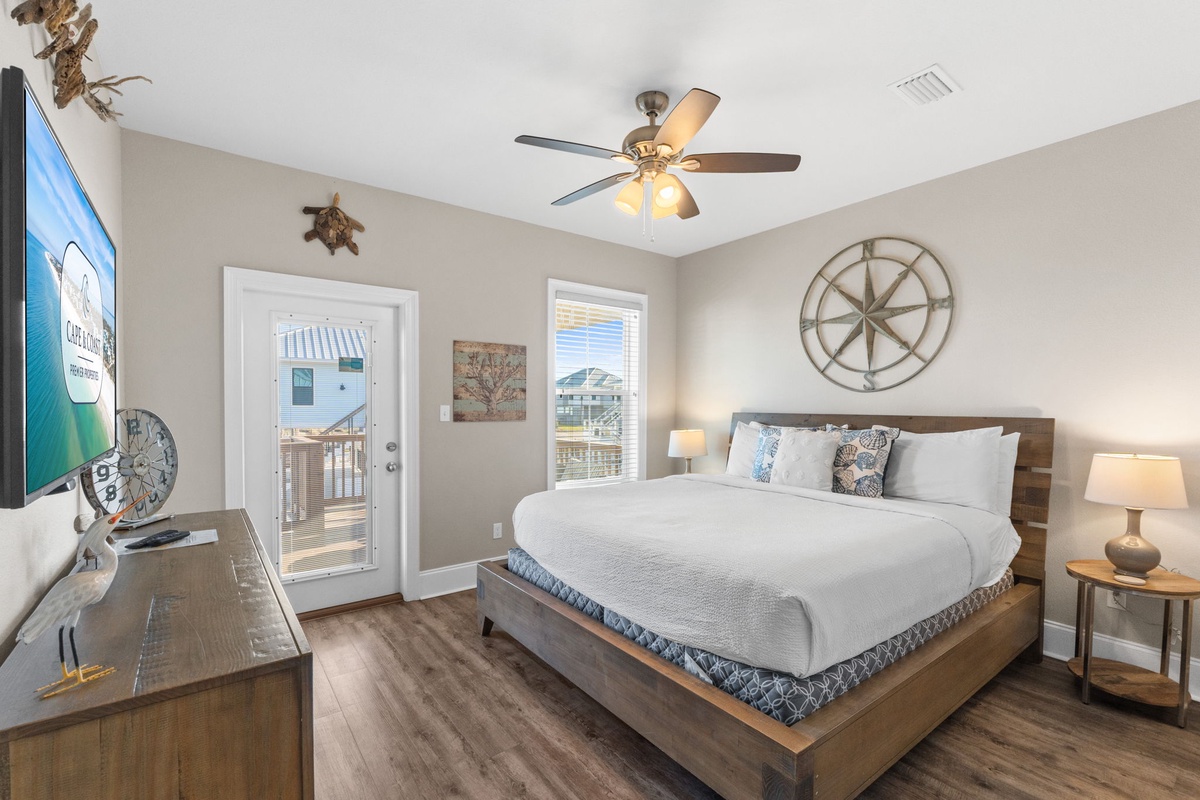 Drift off to sleep in your coastal-themed bedroom with crisp linens, nautical charm, and balcony access to ocean breezes.