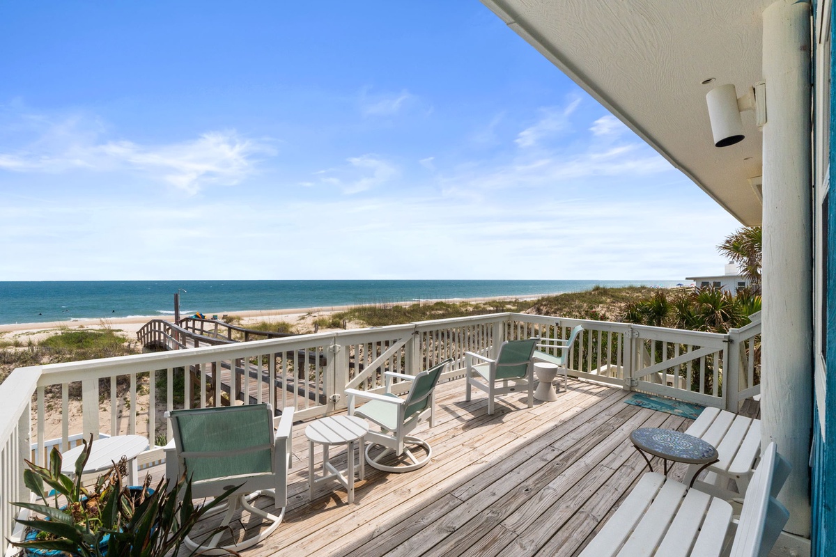 Step onto your private deck and take in the stunning beachfront setting—soft sand, gentle waves, and endless ocean views stretching to the horizon. Your perfect coastal escape awaits.